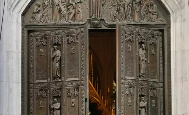 FILE- Musicians, primarily trombonists, play music as the body of Willie Colon leaves St. Patrick's Church in New York, March 9, 2026. (AP Photo/Seth Wenig, File)