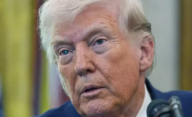President Donald Trump listens to a reporter during the swearing in for Homeland Security Secretary Markwayne Mullin in the Oval Office of the White House, Tuesday, March 24, 2026, in Washington. (AP Photo/Alex Brandon)