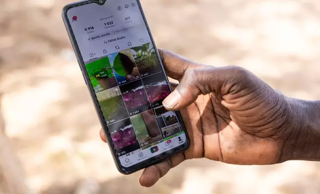 Pape Fall, a West African farmer who turned to Tiktok as part of agriculture's changing image, shows his account in Thies, Senegal, Thursday Dec. 11, 2025. (AP Photo/Caitlin Kelly)