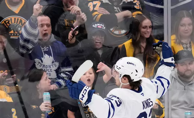Toronto Maple Leafs left wing Matthew Knies (23) celebrates after his goal against the Boston Bruins during the second period of an NHL hockey game, Tuesday, March 24, 2026, in Boston. (AP Photo/Charles Krupa)