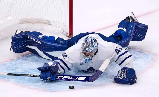 Toronto Maple Leafs goaltender Anthony Stolarz (41) makes a save against the Boston Bruins during the second period of an NHL hockey game, Tuesday, March 24, 2026, in Boston. (AP Photo/Charles Krupa)