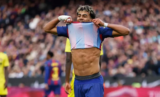 Barcelona's Lamine Yamal reacts after missing a chance to score during the Spanish La Liga soccer match between Barcelona and Villareal in Barcelona, Spain, Saturday, Feb. 28, 2026. (AP Photo/Joan Monfort)