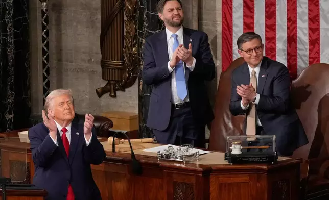 FILE - President Donald Trump, Vice President JD Vance and House Speaker Mike Johnson applaud during the State of the Union address in the House chamber at the U.S. Capitol in Washington, Feb. 24, 2026. (AP Photo/Mark Schiefelbein, File)