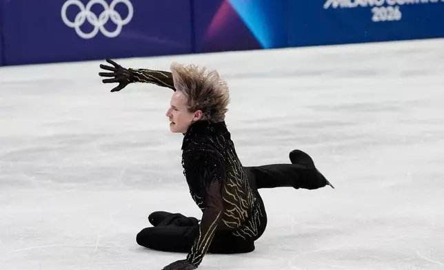 FILE - Ilia Malinin of the United States falls during the men's free skate program in figure skating at the Winter Olympics, in Milan, Italy, Feb. 13, 2026. (AP Photo/Natacha Pisarenko, File)