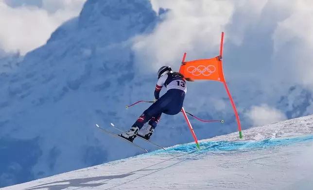 FILE - United States' Lindsey Vonn crashes into a gate during an alpine skiing women's downhill race, at the Winter Olympics, in Cortina d'Ampezzo, Italy, Feb. 8, 2026. (AP Photo/Jacquelyn Martin, File)