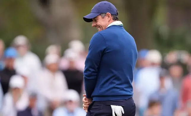 Rory McIlroy of Northern Ireland reacts to his putt on the 11th green during the second round of The Players Championship golf tournament Friday, March 13, 2026, in Ponte Vedra Beach, Fla. (AP Photo/Gerald Herbert)