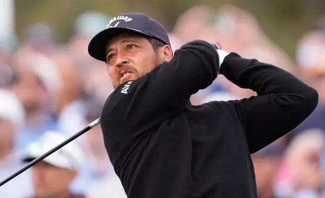 Xander Schauffele hits off the 10th tee during the second round of The Players Championship golf tournament Friday, March 13, 2026, in Ponte Vedra Beach, Fla. (AP Photo/Gerald Herbert)
