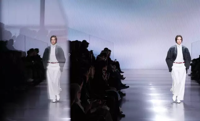 A model wears a creation from the Giorgio Armani Fall/Winter 2026-2027 Women's collection presented in Milan, Italy, Sunday, March 1, 2026. (AP Photo/Antonio Calanni)