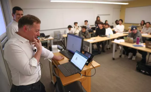 Professor Panos Ipeirotis speaks with an oral AI agent during his class at NYU Stern School of Business, March 4, 2026, in New York. (AP Photo/Heather Khalifa)