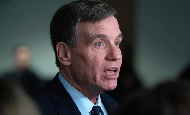 Senate Intelligence Committee Vice Chairman Sen. Mark Warner, D-Va., speaks with reporters after the Senate Committee on Intelligence hearings on Capitol Hill Wednesday, March 18, 2026, in Washington. (AP Photo/Jose Luis Magana)