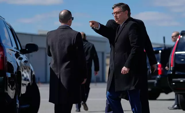 House Speaker Mike Johnson of La., is directed to a vehicle after arriving with President Donald Trump on Air Force One, Wednesday, March 18, 2026, at Dover Air Force Base, Del., to attend the casualty return for the six crew members of an Air Force refueling aircraft who died when their plane crashed in western Iraq while supporting operations against Iran. (AP Photo/Julia Demaree Nikhinson)