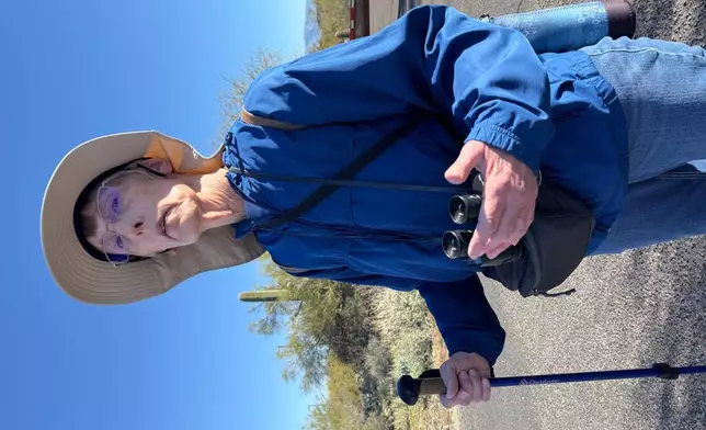 Retired Tucson area teacher Evelyn Spitzer pauses during an accessible birding walk at Feliz Paseos Park in Tucson, Ariz., on Feb. 4, 2026. (Anita Snow via AP)
