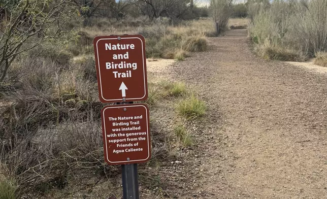 An accessible dirt path leading to a nature and birding trail appears at Feliz Paseos Park in Tucson, Ariz., on Feb. 4, 2026. (Anita Snow via AP)