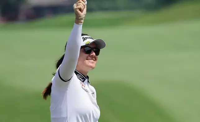 Hannah Green of Australia reacts after winning the HSBC Women's World Championship at Sentosa Golf Club in Singapore, Sunday, March 1, 2026. (AP Photo/Suhaimi Abdullah)