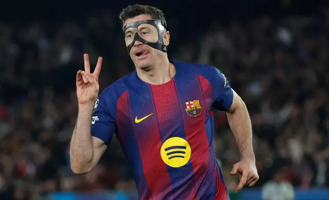 Barcelona's Robert Lewandowski celebrates after scoring his side's sixth goal during the Champions League round of 16, second leg soccer match between FC Barcelona and Newcastle United FC in Barcelona, Spain, Wednesday, March 18, 2026. (AP Photo/Joan Monfort)