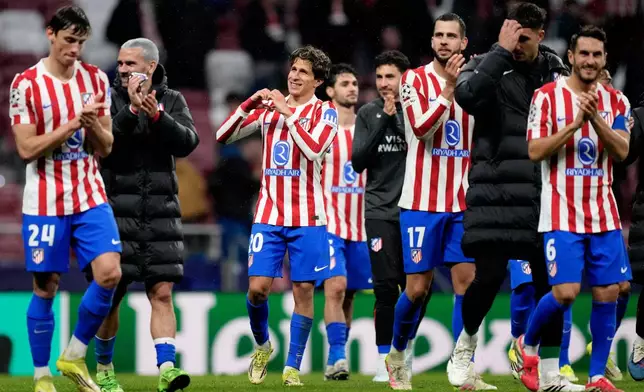 Atletico Madrid players greet fans at the end of the first leg of the Champions League round of 16 soccer match between Atletico Madrid and Tottenham in Madrid, Spain, Tuesday, March 10, 2026. (AP Photo/Jose Breton)