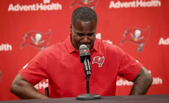 Tampa Bay Buccaneers' Lavonte David becomes emotional while talking about his parents as he announces his retirement during an NFL football news conference, Tuesday, March 24, 2026 in Tampa. (Chris Urso/Tampa Bay Times via AP)