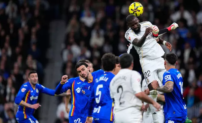 Real Madrid's Antonio Rudiger jumps for the ball during a Spanish La Liga soccer match between Real Madrid and Getafe in Madrid, Spain, Monday, March 2, 2026. (AP Photo/Manu Fernandez)