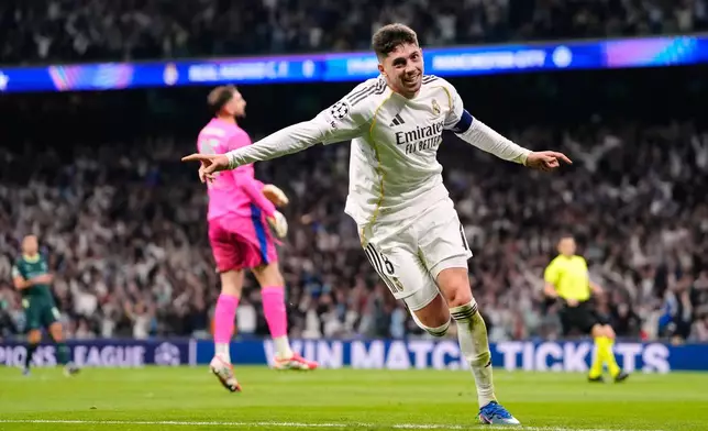 Real Madrid's Federico Valverde celebrates after scoring during a first leg round of 16 Champions League soccer match between Real Madrid and Manchester City in Madrid, Spain, Wednesday, March 11, 2026. (AP Photo/Jose Breton)