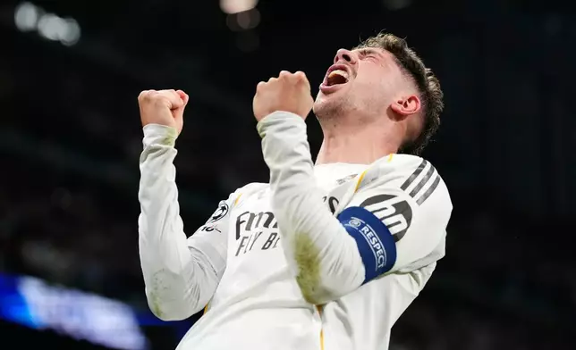Real Madrid's Federico Valverde celebrates after scoring during a first leg round of 16 Champions League soccer match between Real Madrid and Manchester City in Madrid, Spain, Wednesday, March 11, 2026. (AP Photo/Jose Breton)