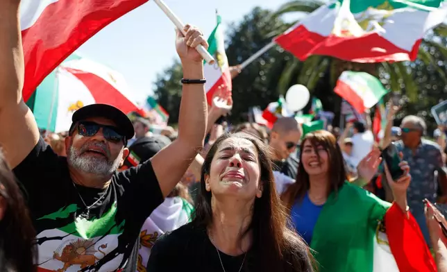Demonstrators gather in reaction to the U.S. and Israeli strikes on Iran on Saturday, Feb. 28, 2026, in Los Angeles. (AP Photo/Caroline Brehman)