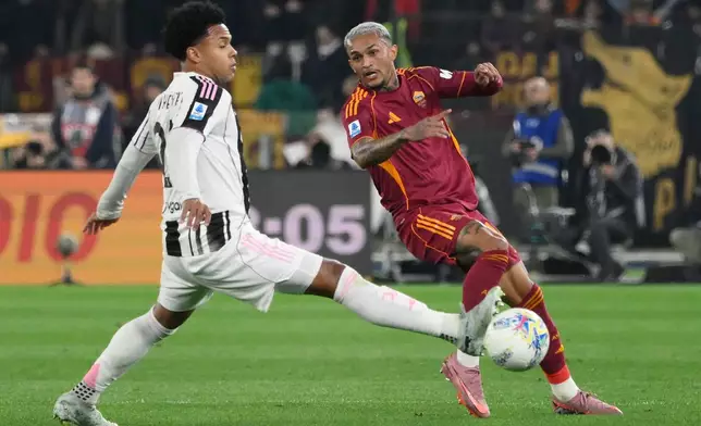 Roma's Wesley, right, and Juventus's Weston McKennie in action during the Serie A soccer match between AS Roma and Juventus FC in Rome, Italy, Sunday March 1, 2026. (Fabrizio Corradetti/LaPresse via AP)