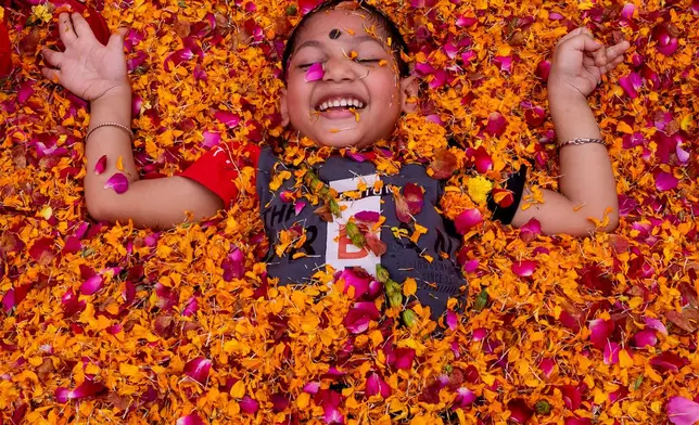 A child with cerebral palsy attends Holi, the Hindu festival of colors, at an event organized by the Trishla Foundation in Prayagraj, India,Sunday, March 1, 2026. (AP Photo/Rajesh Kumar Singh)