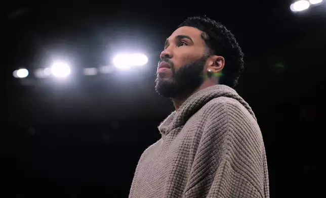 Boston Celtics forward Jayson Tatum stands next to bench during the first half of an NBA basketball game, Wednesday, March 4, 2026, in Boston. (AP Photo/Charles Krupa)