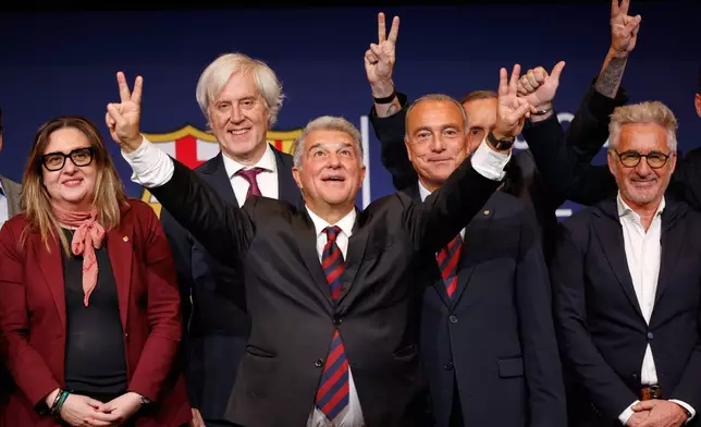 Joan Laporta gestures as he celebrates after being elected president of FC Barcelona following the soccer club's presidential election in Barcelona, Spain, early Monday, March 16, 2026. (AP Photo/Joan Monfort)