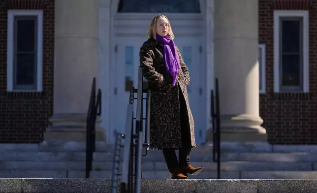 Allison Posner, an organizer for an upcoming "No Kings" protest poses for a photo on the steps of the town hall in Maplewood, N.J., Tuesday, March 24, 2026. (AP Photo/Seth Wenig)