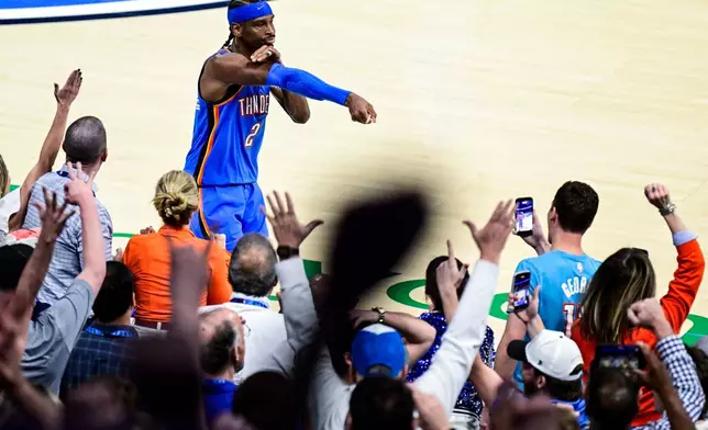 Oklahoma City Thunder guard Shai Gilgeous-Alexander (2) gestures during the second half of an NBA basketball game against the Denver Nuggets Monday, March 9, 2026, in Oklahoma City. (AP Photo/Gerald Leong)