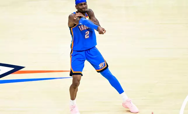 Oklahoma City Thunder guard Shai Gilgeous-Alexander (2) gestures during the second half of an NBA basketball game against the Denver Nuggets Monday, March 9, 2026, in Oklahoma City. (AP Photo/Gerald Leong)