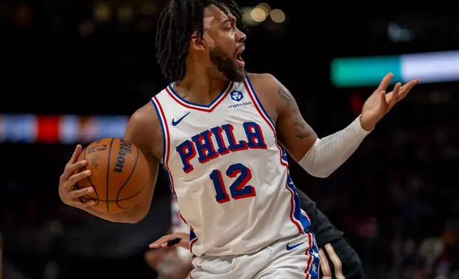 Philadelphia 76ers guard/forward Trendon Watford (12) reacts after a call during the first half of an NBA basketball game against the Atlanta Hawks, Saturday, March 7, 2026, in Atlanta. (AP Photo/Erik Rank)