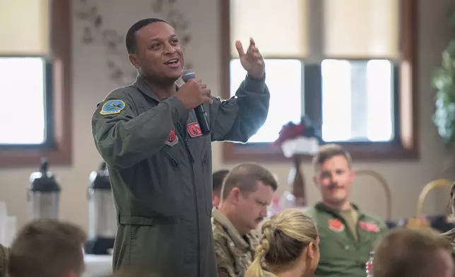 In this photo provided by the U.S. Air National Guard, U.S. Air Force Tech. Sgt. Tyler Simmons, a boom operator assigned to the Ohio National Guard's 121st Air Refueling Wing in Columbus, Ohio, speaks during the Enlisted Leadership Symposium at Youngstown Air Reserve Station in Youngstown, Ohio, on June 27, 2023. (Airman 1st Class Nicholas Battani/U.S. Air National Guard via AP)