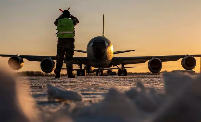 In this Jan. 28, 2026 photo, U.S. Air Force Master Sgt. Aaron Slupski, a crew chief with the 121st Maintenance Group, prepares to marshal a KC-135 Stratotanker at Rickenbacker Air National Guard Base, Columbus, Ohio. Ohio Gov. Mike DeWine said Friday that three of six crew members of an American KC-135 refueling plane were killed when it crashed in Iraq were from his state and had deployed with the Ohio Air National Guard's 121st Air Refueling Wing. (Ralph Branson, U.S. Air National Guard photo via AP)