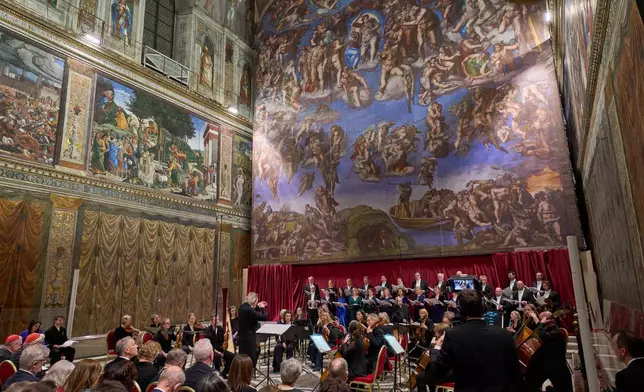 The Sixteen perform Angels Unawares byJames MacMillan, conducted by Harry Christopher in the Sistine Chapel at the Vatican, Sunday, March 22, 2026. (AP Photo/Domenico Stinellis)