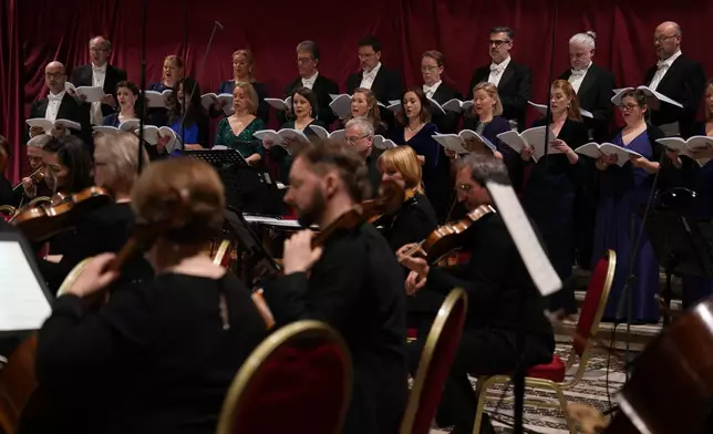The Sixteen perform Angels Unawares by James MacMillan and conducted by Harry Christopher in the Sistine Chapel at the Vatican, Sunday, March 22, 2026. (AP Photo/Domenico Stinellis)