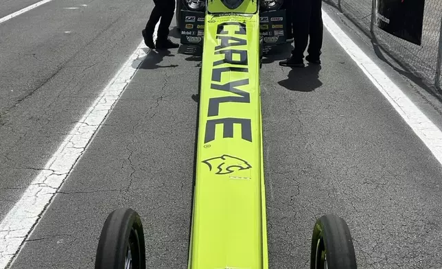 NHRA driver Maddi Gordon waits in her dragster as her team gets her Top Fuel entry ready for before an elimination run at the Gatornationals, at Gainesville Raceway in Gainesville, Fla., Sunday, March 8, 2026. (AP Photo/Mark Long)