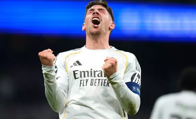 Real Madrid's Federico Valverde celebrates after scoring during a first leg round of 16 Champions League soccer match between Real Madrid and Manchester City in Madrid, Spain, Wednesday, March 11, 2026. (AP Photo/Jose Breton)