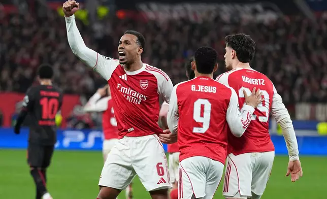 Arsenal's Gabriel celebrates the first goal of his team during the Champions League round of 16 first leg soccer match between Bayer Leverkusen and Arsenal FC in Leverkusen, Germany, Wednesday, March 11, 2026. (AP Photo/Martin Meissner)