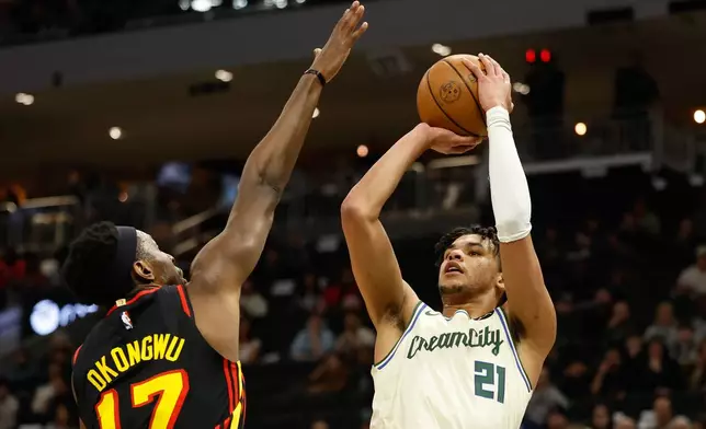 Milwaukee Bucks forward Ousmane Dieng (21) shoots against the Atlanta Hawks during the first half of an NBA basketball game Wednesday, March 4, 2026, in Milwaukee. (AP Photo/Jeffrey Phelps)