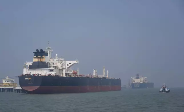 Liberia-flagged tanker Shenlong Suezmax, carrying crude oil from Saudi Arabia, that arrived clearing the Strait of Hormuz, is seen at the Mumbai Port in Mumbai, India, Thursday, March 12, 2026. (AP Photo/Rafiq Maqbool)