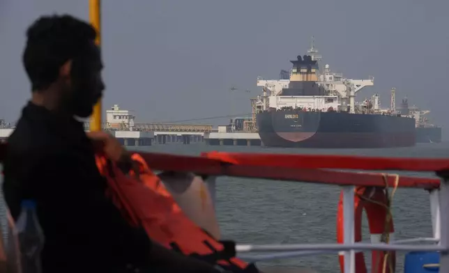 Liberia-flagged tanker Shenlong Suezmax, carrying crude oil from Saudi Arabia, that arrived clearing the Strait of Hormuz, is seen at the Mumbai Port in Mumbai, India, Thursday, March 12, 2026. (AP Photo/Rafiq Maqbool)