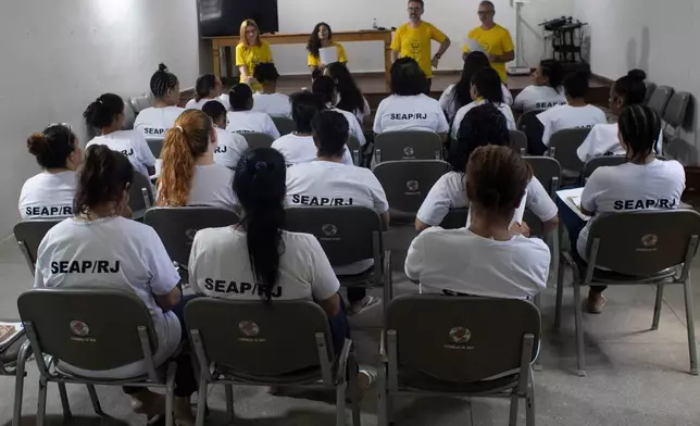 Incarcerated women participate in a reading program part of the Federal University of Rio de Janeiro's "Literature, Existence and Resistance" project, at the Djanira Dolores de Oliveira women's prison in Rio de Janeiro, Wednesday, March 25, 2026. (AP Photo/Bruna Prado)