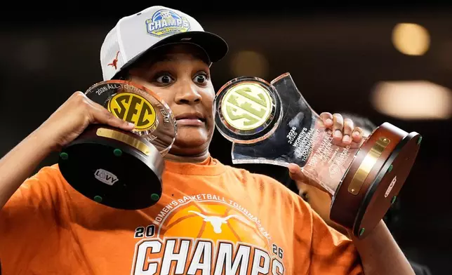Texas forward Madison Booker celebrates after their win against South Carolina in an NCAA college basketball game in the final of the Southeastern Conference tournament, Sunday, March 8, 2026, in Greenville, S.C. (AP Photo/Chris Carlson)