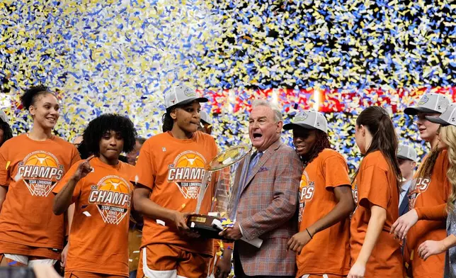Texas celebrates after their win against South Carolina in an NCAA college basketball game in the final of the Southeastern Conference tournament, Sunday, March 8, 2026, in Greenville, S.C. (AP Photo/Chris Carlson)