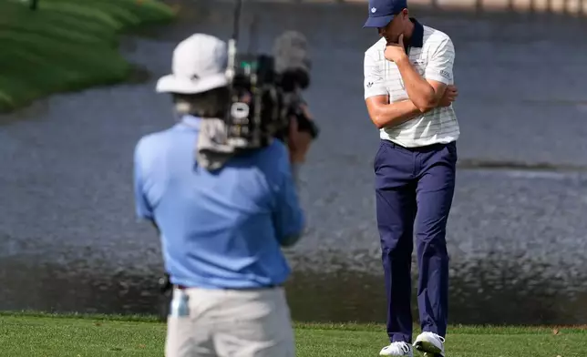 Ludvig Aberg of Sweden, reacts to his ball hitting the water on the 12th hole during the final round of The Players Championship golf tournament, Sunday, March 15, 2026, in Ponte Vedra Beach, Fla. (AP Photo/Gerald Herbert)