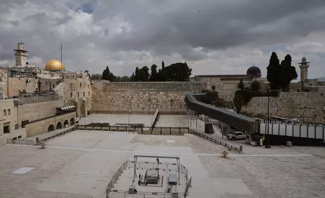 The Western Wall plaza in Jerusalem's Old City stands empty as the area remains closed to visitors amid the war with Iran. Wednesday, March 25, 2026. (AP Photo/Mahmoud Illean)
