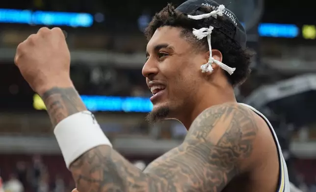 Michigan's Yaxel Lendeborg celebrates after defeating Tennessee in the Elite Eight of the NCAA college basketball tournament, Sunday, March 29, 2026, in Chicago. (AP Photo/Erin Hooley)
