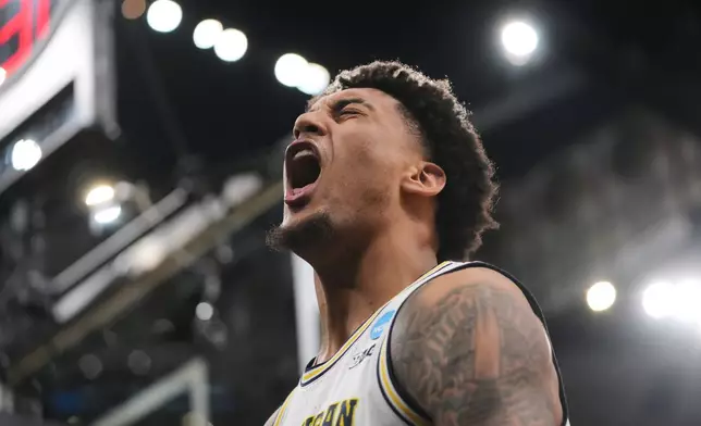 Michigan's Yaxel Lendeborg (23) celebrates during the second half in the Elite Eight of the NCAA college basketball tournament against Tennessee, Sunday, March 29, 2026, in Chicago. (AP Photo/Erin Hooley)
